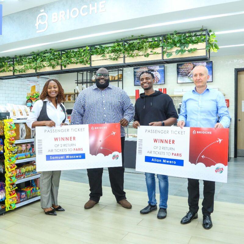 Award of the air tickets to the winners at Brioche Karen by RUBiS Energy Group Managing Director and CEO East Africa, Mr. Jean-Christian Bergeron