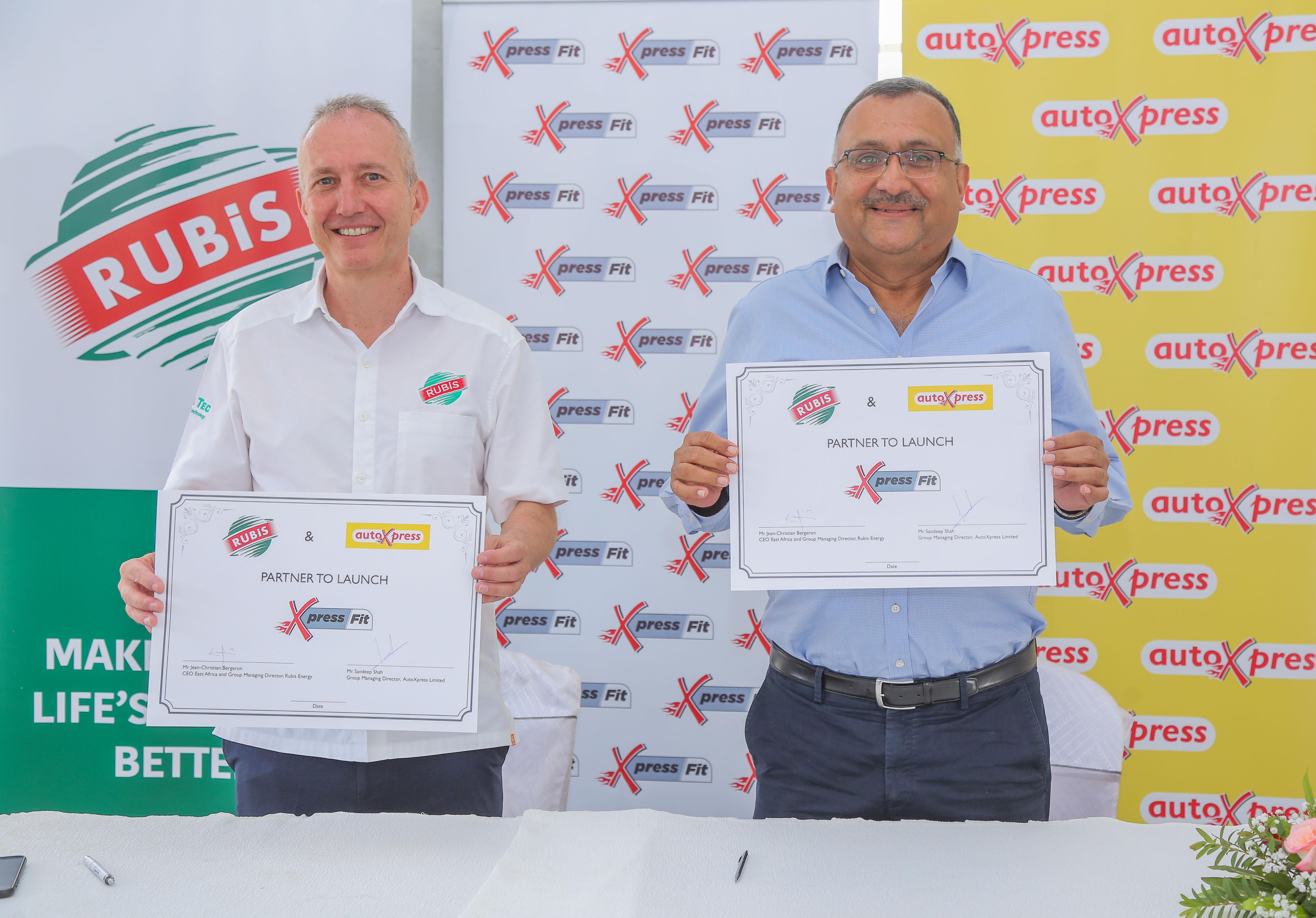 Jean-Christian Bergeron, CEO East Africa and Group Managing Director, Rubis Energy Kenya alongside Sandeep Shah, Group Managing Director, AutoXpress holding certificates showing their partnership for Xpress fit.